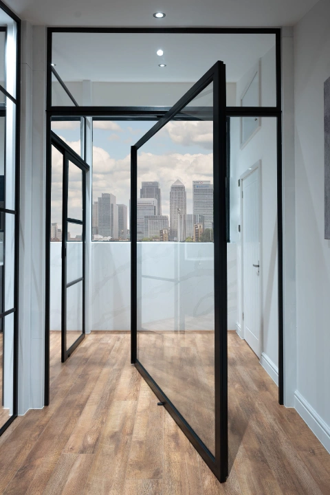 Modern Interior with Cityscape View and Pivot Door