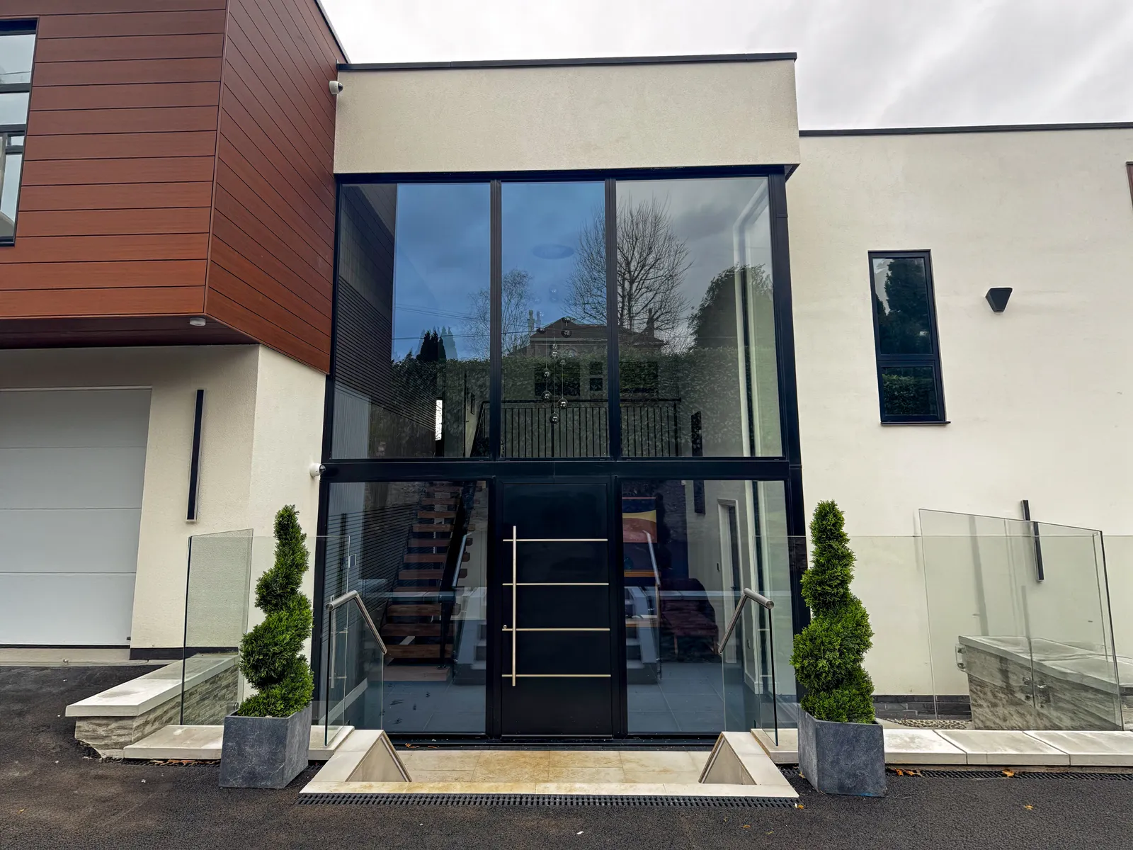 house with black aluminium doors and windows