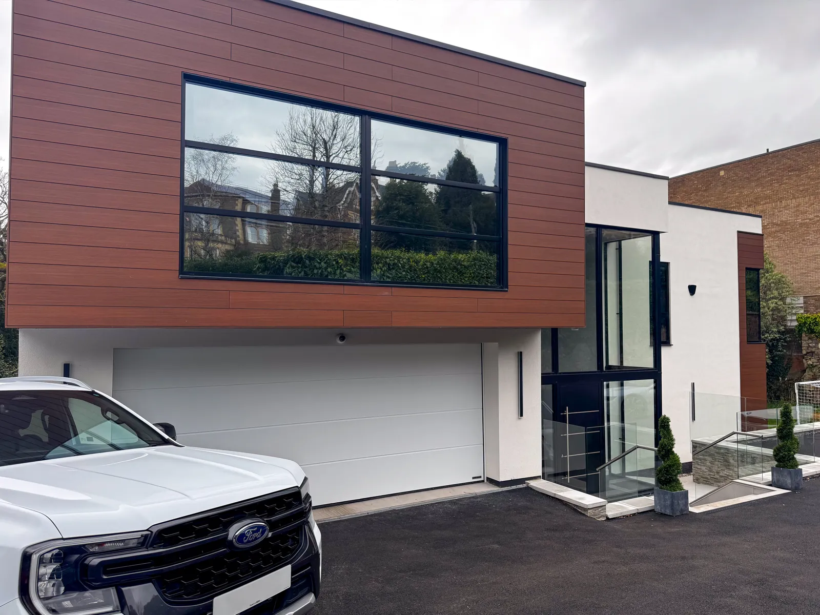house with black aluminium doors and windows